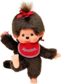 Sekiguchi 255184 - Original Monchhichi Mädchen, Aus Braunem Plüsch, Mit Weiß Rotem Lätzchen Und Roter Schleife Im Haar, Ca. 20 Cm